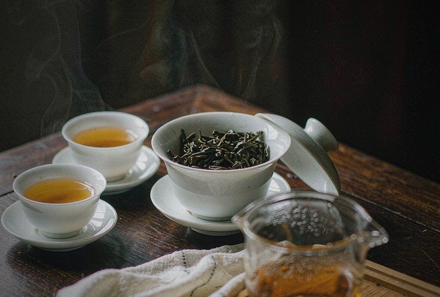 A cup of brewed Dancong showing golden amber liquor